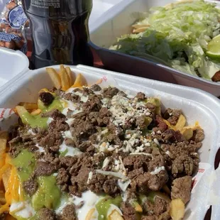 Carne asada fries and 2 fish tacos