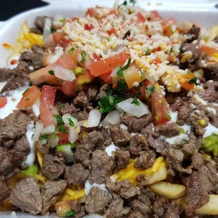 Carne Asada Fries $11.50. Full order. They sell half orders too