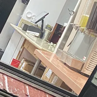 Big Cockroach at the corner of the shelf that the Agua Frescas are on.