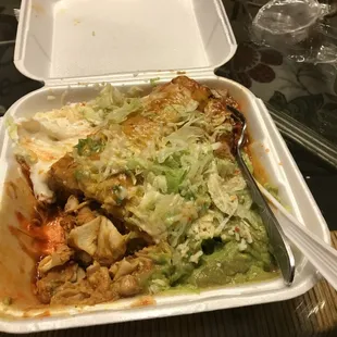 Chicken chimichanga partially eaten.