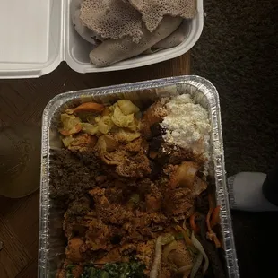 a tray of food and a container of rice