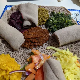 Veggie combo.  So tasty.  It's always fun to eat with your hands.  #ethiopianfood #injera