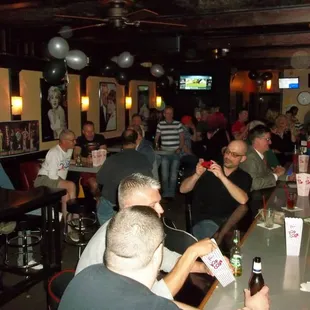 a group of people sitting at a bar