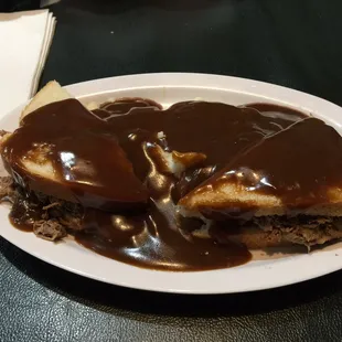 Smothered roast beef with mashed potatoes