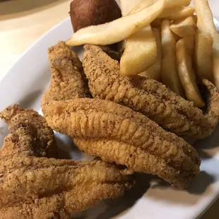 a plate of fried fish and french fries