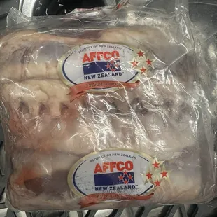 Package of frozen lamb chop racks.