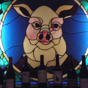 a pig in a stained glass window