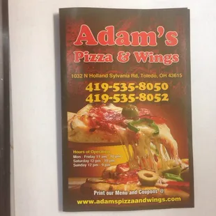 a sign for adam's pizza and wings