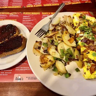 Trio Omelette with added onions and green peppers, Side of Home Fries, Side Toast
