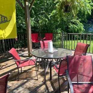 a table and chairs on a deck