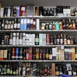 a shelf of liquor bottles