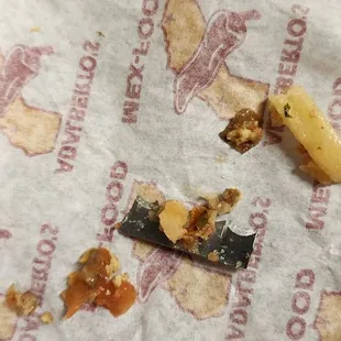 A sharp blade in a burrito uncovered as I took a bite that cut my gums/cheek as I spat it out.