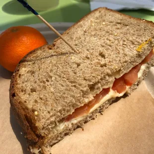 a sandwich and an orange