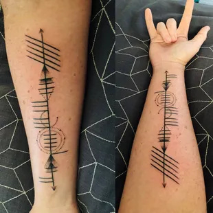 Ogham with artistic license.  Brian Ashcraft is a great artist and was able to tattoo with precision.  Amazing!