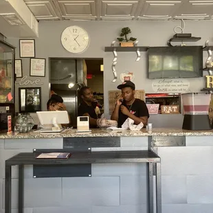 Front desk staff handles call-in orders and walk-ins.