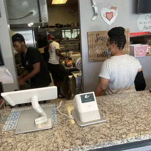 Front desk &amp; kitchen staff, hard at work.