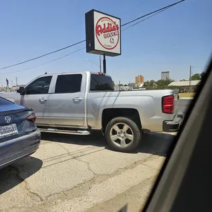a truck and a car in a parking lot