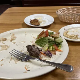 A finished plate of beef and chicken Kebab