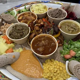 Check out the injera--the thick rolled crepe we used to mop all this up.
