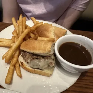 Roast beef french dip sandwich with french fries