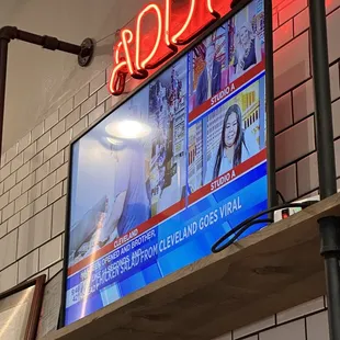 a neon sign above the counter