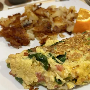 Diner omelet with spinach, tomato, onion, cheddar. And the famous home fries.