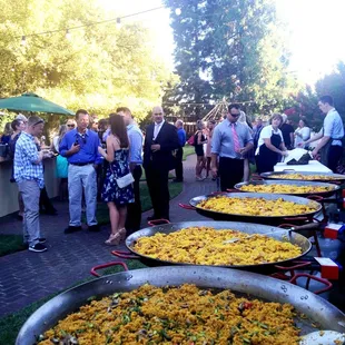 The Paella line up at our wedding of 150 guests.