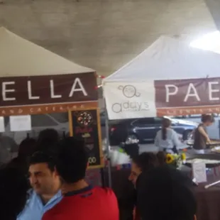 Location was a stand at the sactomofo event and they were cooking the paella in bulk to the right.