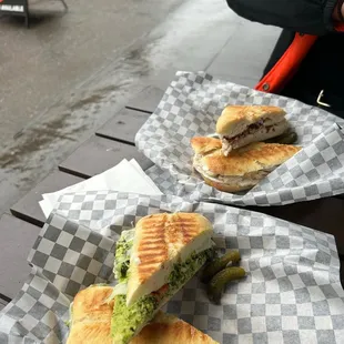 two sandwiches on a table