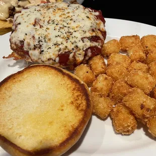 Chicken parm sandwich w tots :) If you can&apos;t tell, it is HUGE :) I got 2 meals out of this, and that&apos;s w/o taking the leftover tots home.