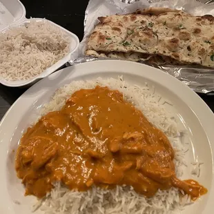Chicken Tikka Masala (bottom), Garlic Naan (top right), basmati rice (top left)