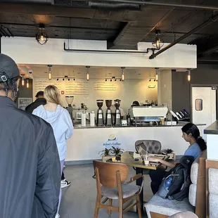 a group of people in a coffee shop