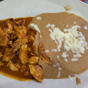 Chicken Colorado with Red and Green Sauces and Refried Beans