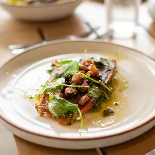 a plate of food on a wooden table