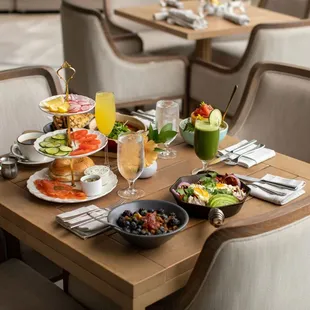 a wooden table with a variety of food on it