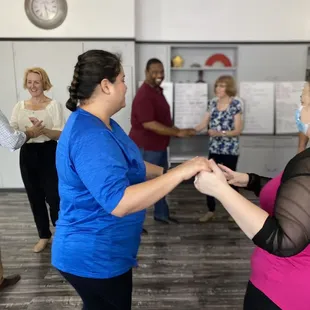 Happy dancers and joyful students in casino reuda class.