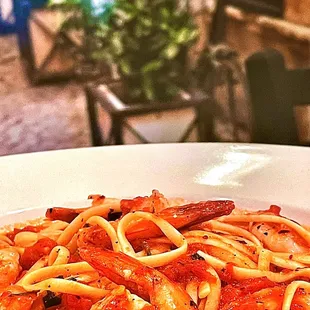 a plate of pasta and shrimp