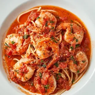 a plate of pasta with shrimp