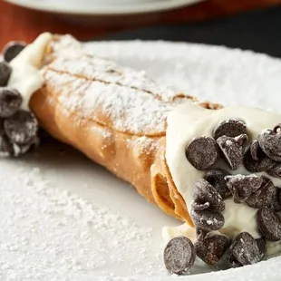 a pastry with chocolate chips and cream