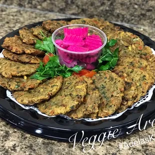 a plate of vegetable patties