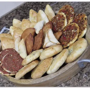 a bowl of breads and pastries