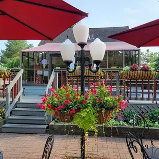 a patio with tables and umbrellas