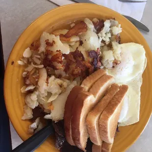 Steak, eggs, fried potatoes, and toast!