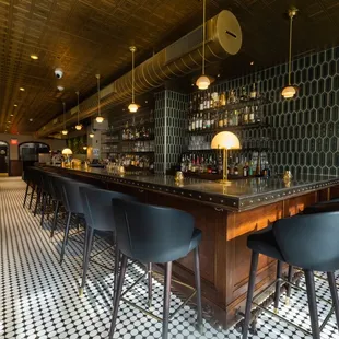 a bar with black and white checkered floor