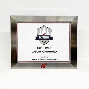 a picture of a plaque for the top shelf champion award