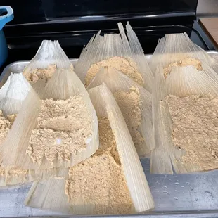 Tamales I was making with their masa and corn husks.