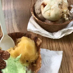Pistachio and Mango in waffle bowl; Mocha, Caramel, and Kit Kat in waffle bowl