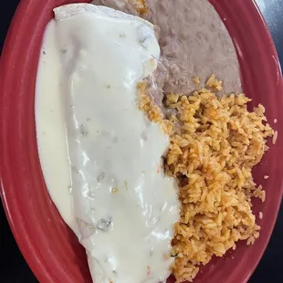 Bean burrito, smothered in white cheese, beans, and rice
