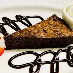 Flourless Chocolate Cake, French Vanilla Ice Cream, Whipped Cream, Fresh Strawberries