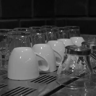 a row of empty coffee mugs